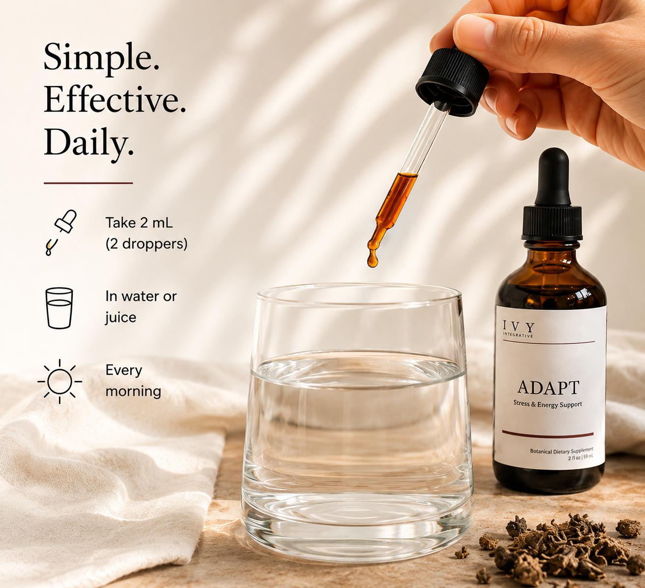 Hand using a dropper to add liquid from a bottle labeled 'Adapt' into a glass on a wooden surface.