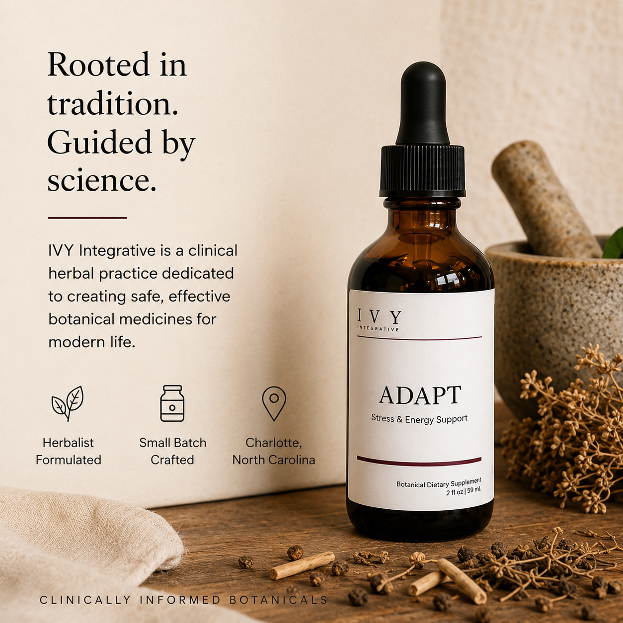 Brown glass bottle with dropper labeled 'IVY' on a wooden surface with herbs and mortar and pestle.